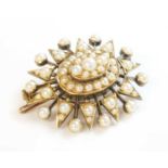 A Victorian gold split pearl oval starburst brooch/pendant, c.1900,