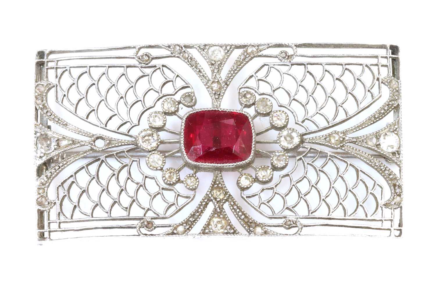 An Art Deco synthetic ruby and diamond rectangular plaque brooch,