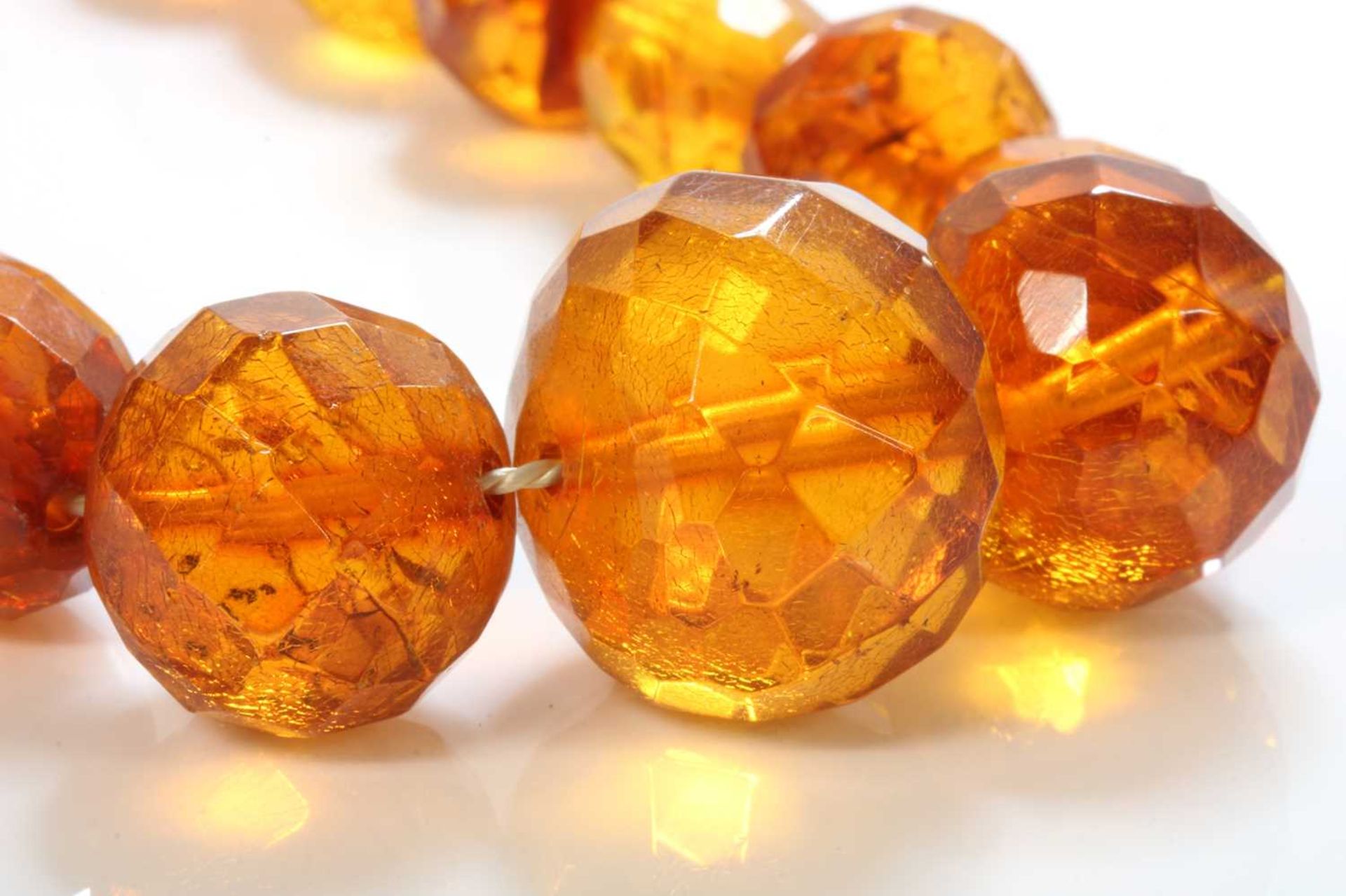 A single row faceted cognac amber bead necklace, - Image 2 of 2