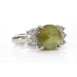 A platinum single stone chrysoberyl cat's eye ring,