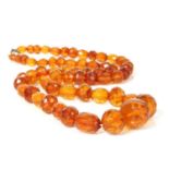 A single row faceted cognac amber bead necklace,