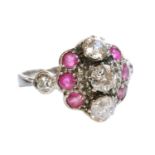 A white gold diamond and ruby cluster ring, c.1935,