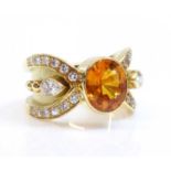 A golden yellow sapphire and diamond band ring,
