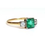 A three stone emerald and diamond ring,