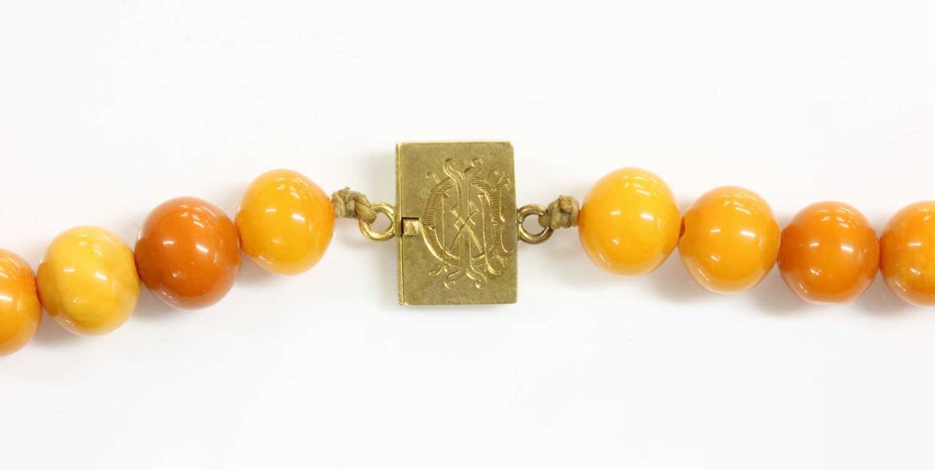 A single row uniform spherical butterscotch amber bead necklace, - Image 3 of 6