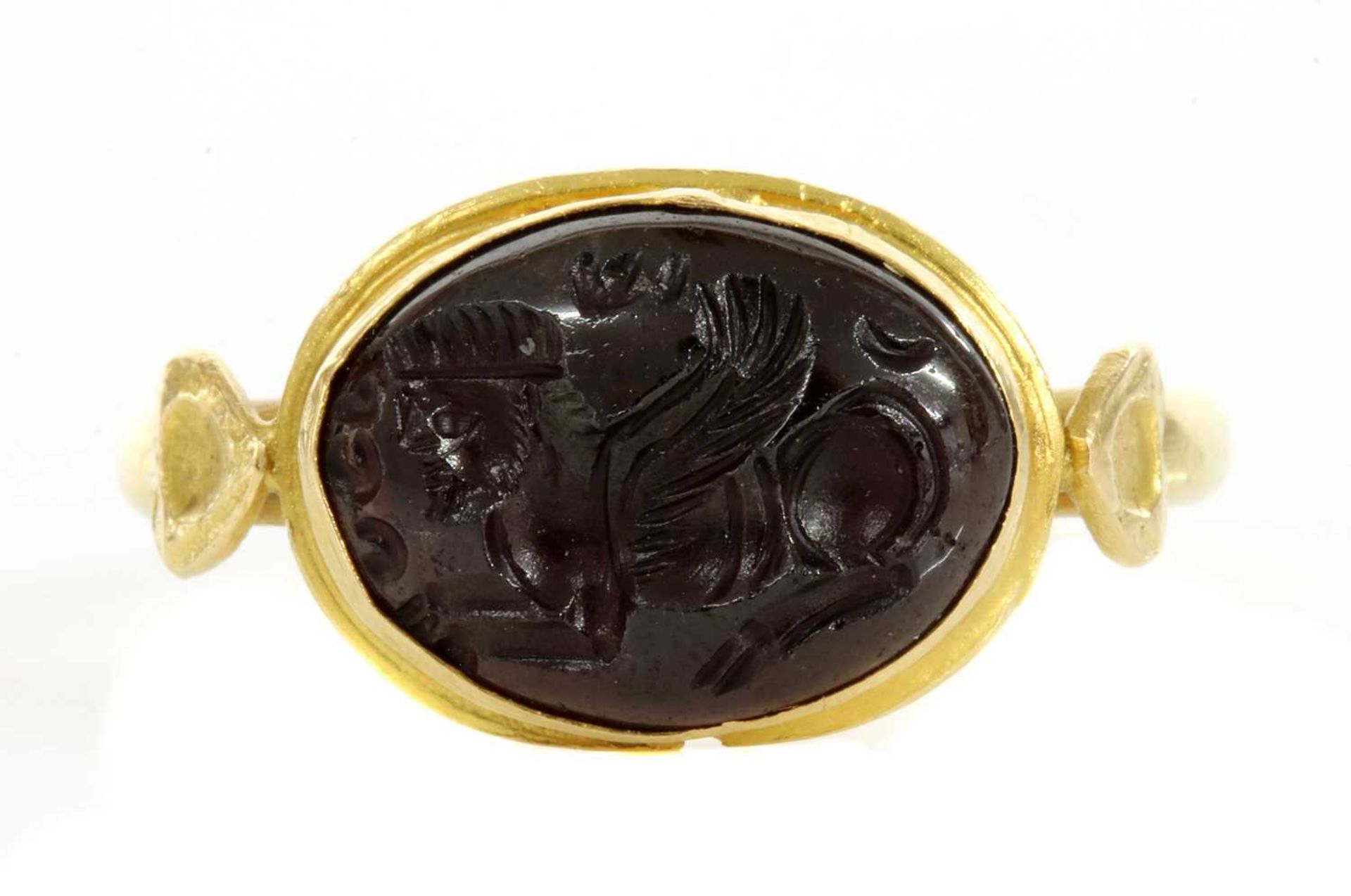 A Byzantine gentlemen's high carat gold cabochon garnet intaglio ring,