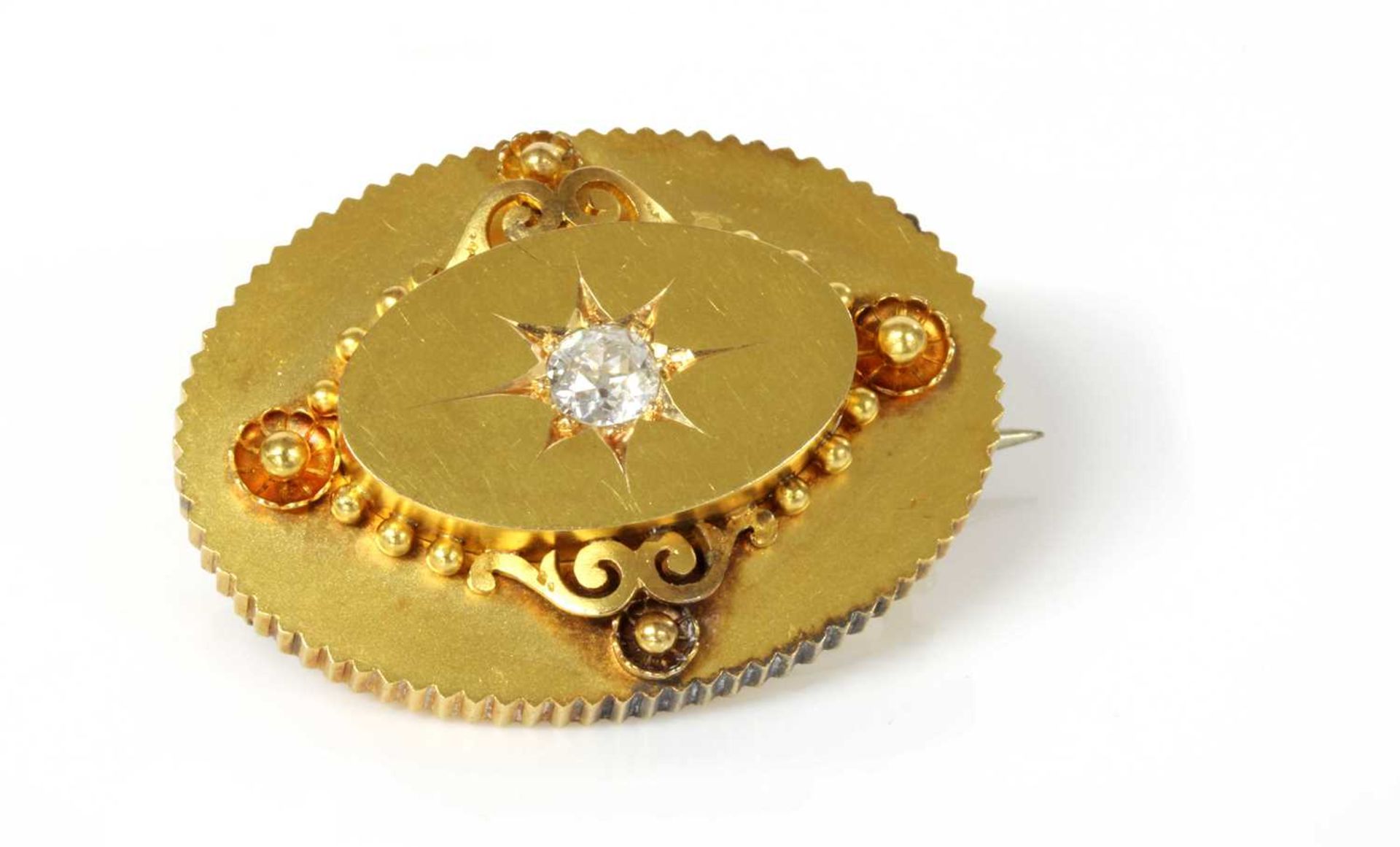 A Victorian gold diamond set oval shield form brooch, c.1870,