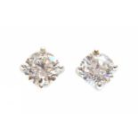A pair of white gold single stone diamond earrings,