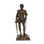 A bronze of a knight in armour,