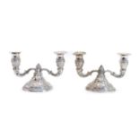 A pair of Continental silver dwarf twin branch candelabra,