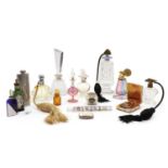 A collection of perfume bottles and dressing jars,