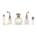 Five cut glass silver collared perfume bottles,