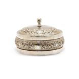 An Indian white metal jar and cover of squat circular form,
