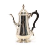 A silver coffee pot,