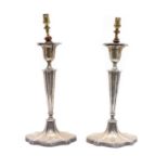 A pair of early 20th century silver candlesticks,