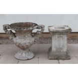 A large faux marble garden urn,