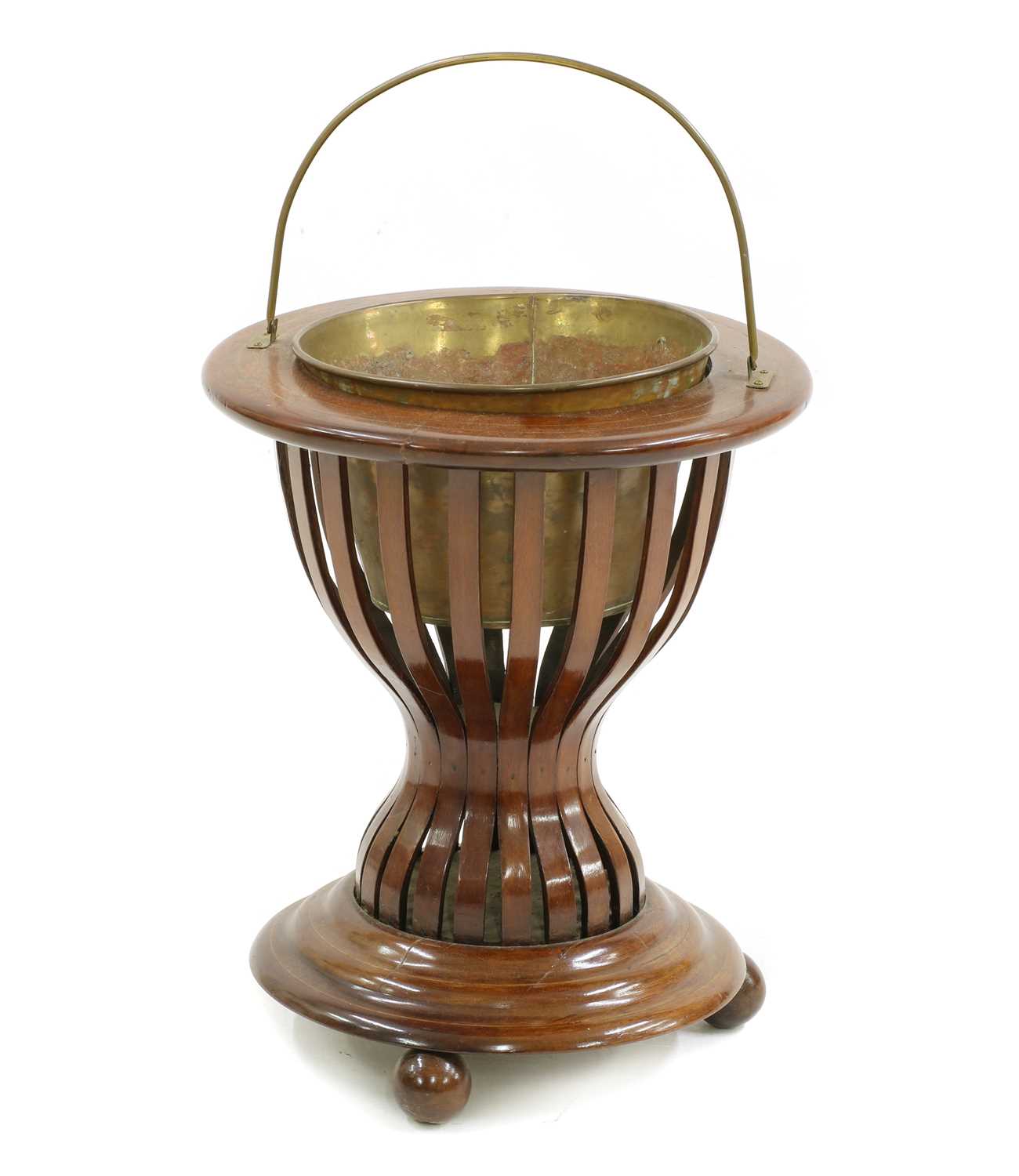 An Edwardian mahogany circular jardinière