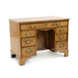 A Victorian walnut kneehole desk,