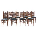 A set of eight Arts and Crafts oak dining chairs,