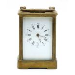 A brass carriage clock,