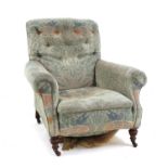 A Victorian Howard type armchair,