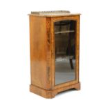 A Victorian strung walnut music cabinet