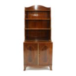 A Regency style strung mahogany waterfall bookcase,