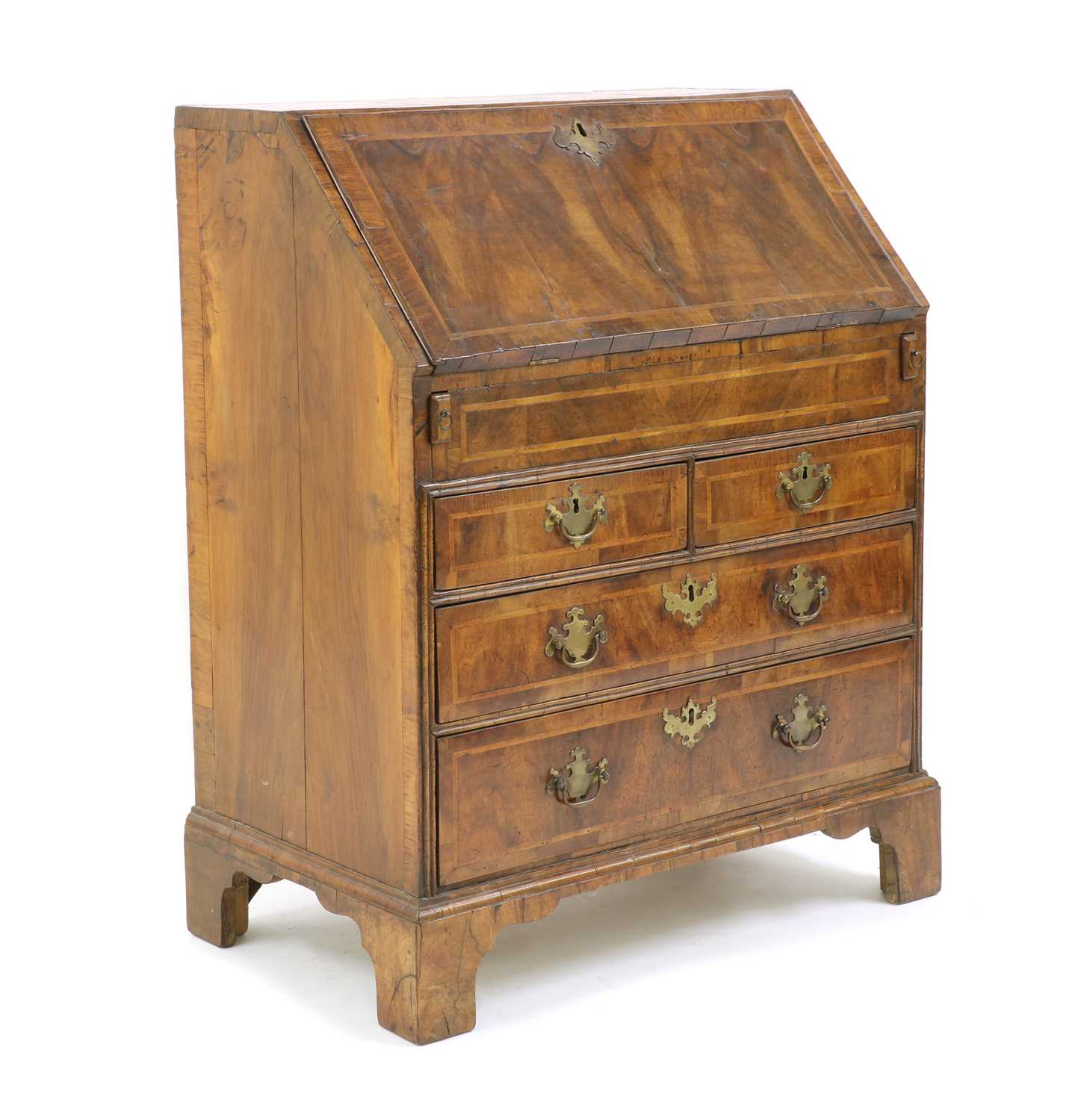 A George II feather strung and crossbanded walnut bureau