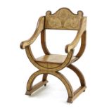 A walnut Savonarola type chair,