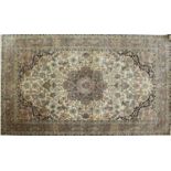 A Persian silk rug