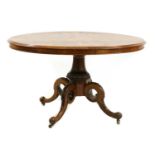 An early Victorian burr walnut oval tilt top table,