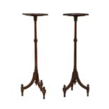 A pair of Edwardian mahogany torcheres,