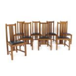 A set of eight oak dining chairs,