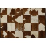 A cowhide rug,