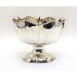 A footed silver bowl,