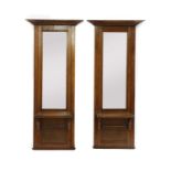 A pair of early 20th century oak pier mirrors