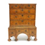 An early 18th century and later walnut chest on stand,