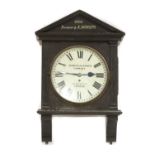 An Edwardian oak cased wall clock,