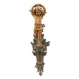 A carved softwood wall light,