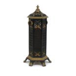 A Gothic Revival wrought iron and gilt veritas stove,