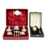 An Edwardian cased silver cruet set,