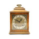 An early 20th century walnut cased two train mantel clock,