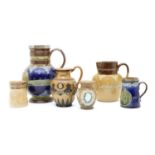 A collection of Doulton commemorative stoneware,