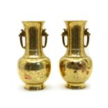 A pair of Chinese brass vases,