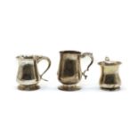 Three silver baluster mugs,
