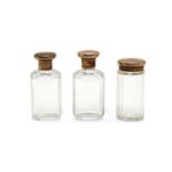 A set of three 9ct gold mounted faceted glass toilet jars