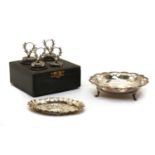 A cased set of four silver menu holders,