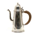 A silver chocolate pot,