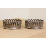A pair of William lV silver decanter coasters,