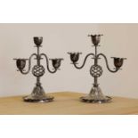 A pair of silver-plated candlesticks,